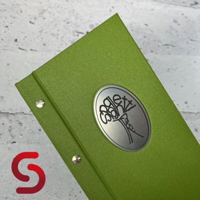 These green menu covers are crafted from durable Buckram-Athens material. Each cover features an engraved logo plaque and an external screw fix, perfect for dynamic venues. 🙌

Made for @spaghettitreewalton. 

Enquire here - Link in bio!

#menucover #menucovers #restaurant #hospitality #buckram